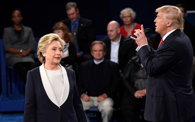 Democratic presidential nominee Hillary Clinton, reacts as Republican presidential nominee Donald Trump during the second presidential debate at Washington University in St. Louis, Sunday, Oct. 9, 2016. (Saul Loeb/Pool via AP)