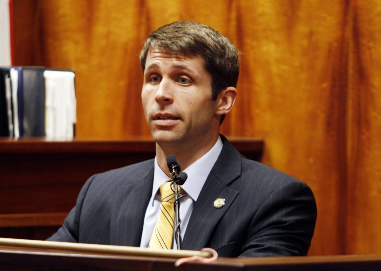 FILE - In this file Aug. 6, 2013 file photo, Christopher Deedy testifies in court in Honolulu. Deedy, a State Department special agent, is accused of murder after he shot and killed a man at a Waikiki McDonald's restaurant in 2011. On Thursday, July 10, 2014, opening statements begin in the retrial of the federal agent, nearly a year after the first one ended with a deadlocked jury. (AP Photo/Honolulu Star-Advertiser, Dennis Oda, File)