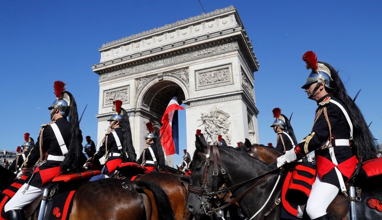 Last July 14, President Trump visited Paris and witnessed the city's Bastille Day military parade. Since then, reports say the president has been keen on having a military parade of his own. (Etienne Laurent, Pool via AP)