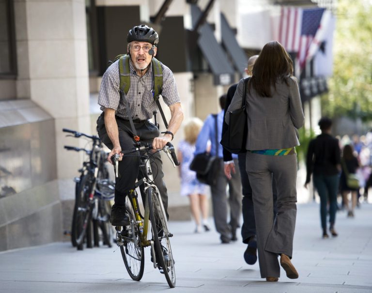   Retired physician David Hilfiker, of Washington, leaves the National Press Club on his bike after talking about his life with Aalzheimer's in Washington, Thursday, Sept. 19, 2013. Hilfiker, was diagnosed in September 2012, and has been writing about the experience of losing his mental capacity in his blog 