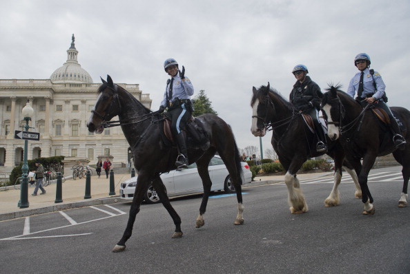 Members of the U.S. Park Police Horse Mounted Unit, walk past the House side of the Capitol. (Photo By Tom Williams/CQ Roll Call)