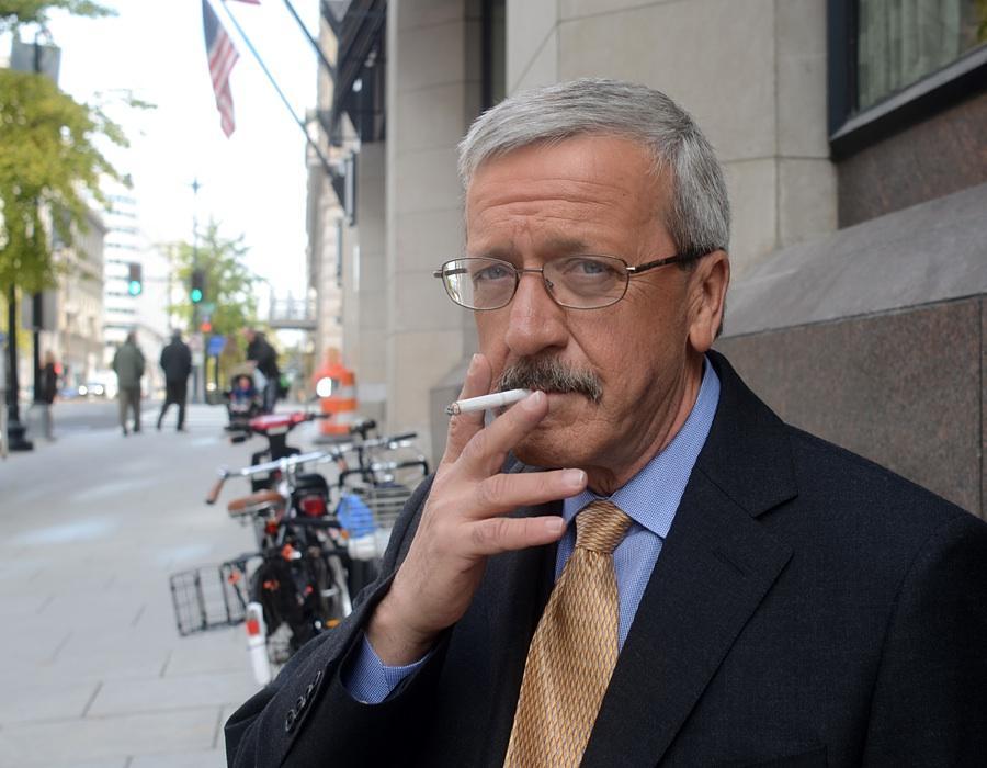 Sightings: Cain’s smoking staffer smokes outside Press Club