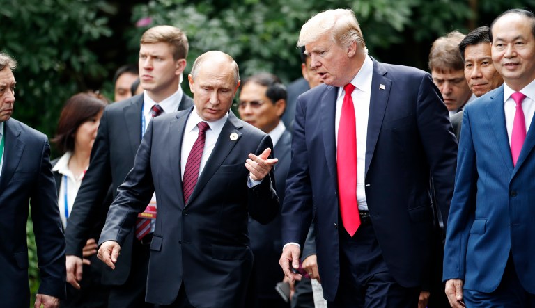 In a holiday telegram, Russian President Vladimir Putin (pictured left) told President Trump 