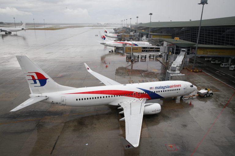 A Malaysia Airlines Boeing 737-800 plane sits on tarmac at Kuala Lumpur International Airport in Sepang, Malaysia, Friday, Aug. 8, 2014. Malaysia's state investment company said Friday it plans to make Malaysia Airlines fully government owned, removing it from the country's stock exchange before carrying out a far-reaching overhaul of the carrier that is reeling from double disasters. (AP Photo/Vincent Thian)