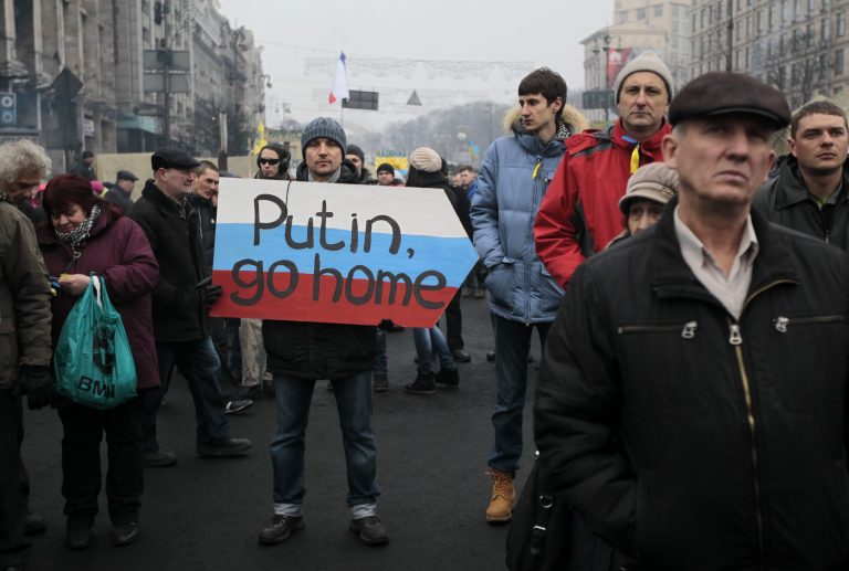 People gather during a rally in Kiev's Independence Square on Sunday.(AP Photo/Sergei Chuzavkov)