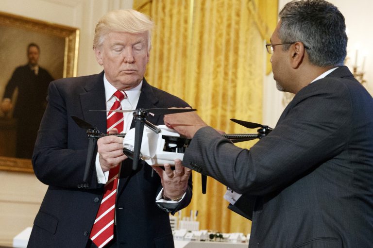 George Mathew, CEO of Kespry, shows a drone to President Trump during the 