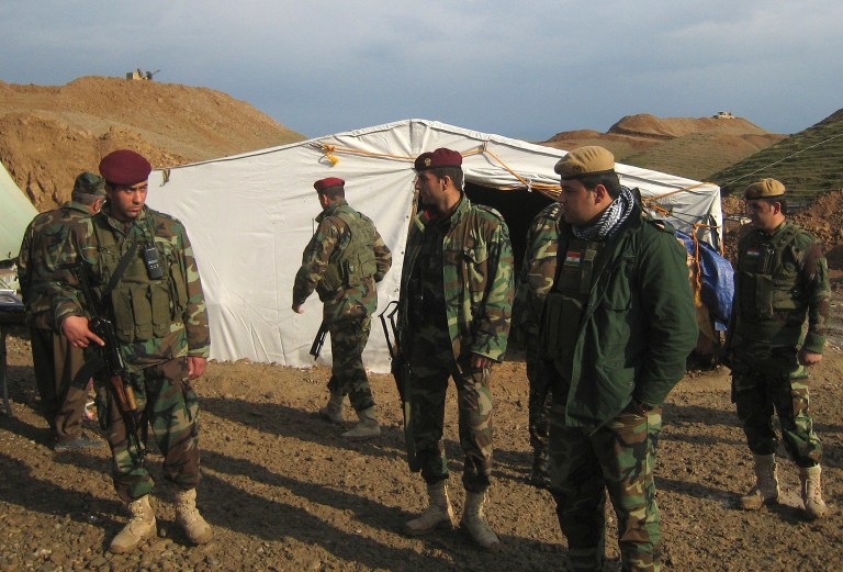   In this Dec. 11, 2012 Peshmerga members gathering in a Kurdish military camp at the outskirts of Kirkuk, in Kirkuk, 290 kilometers (180 miles) north of Baghdad, Iraq. (AP Photo/Emad Matti)  