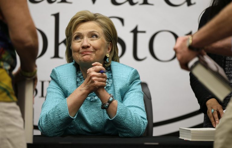 Former Secretary of State HiIlary Rodham Clinton speaks with people while signing copies of her new book 
