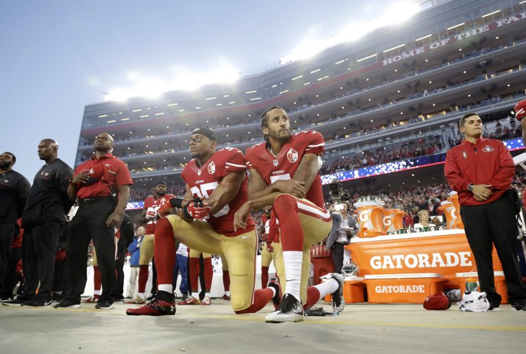 FILE - In this Sept. 12, 2016, file photo, San Francisco 49ers safety Eric Reid (35) and quarterback Colin Kaepernick (7) kneel during the national anthem before an NFL football game against the Los Angeles Rams in Santa Clara, Calif. What began more than a year ago with a lone NFL quarterback protesting police brutality against minorities by kneeling silently during the national anthem before games has grown into a roar with hundreds of players sitting, kneeling, locking arms or remaining in locker rooms, their reasons for demonstrating as varied as their methods.
		 (AP Photo/Marcio Jose Sanchez, File)