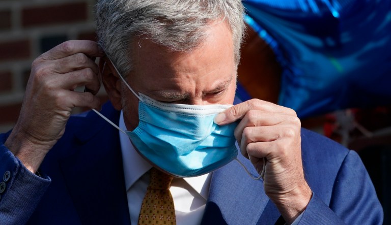 New York Mayor Bill de Blasio attends a ceremony at ground zero in New York, Monday, Sept. 11, 2017. Holding photos and reading names of loved ones lost 16 years ago, 9/11 victims' relatives marked the anniversary of the attacks at ground zero on Monday with a solemn and personal ceremony.