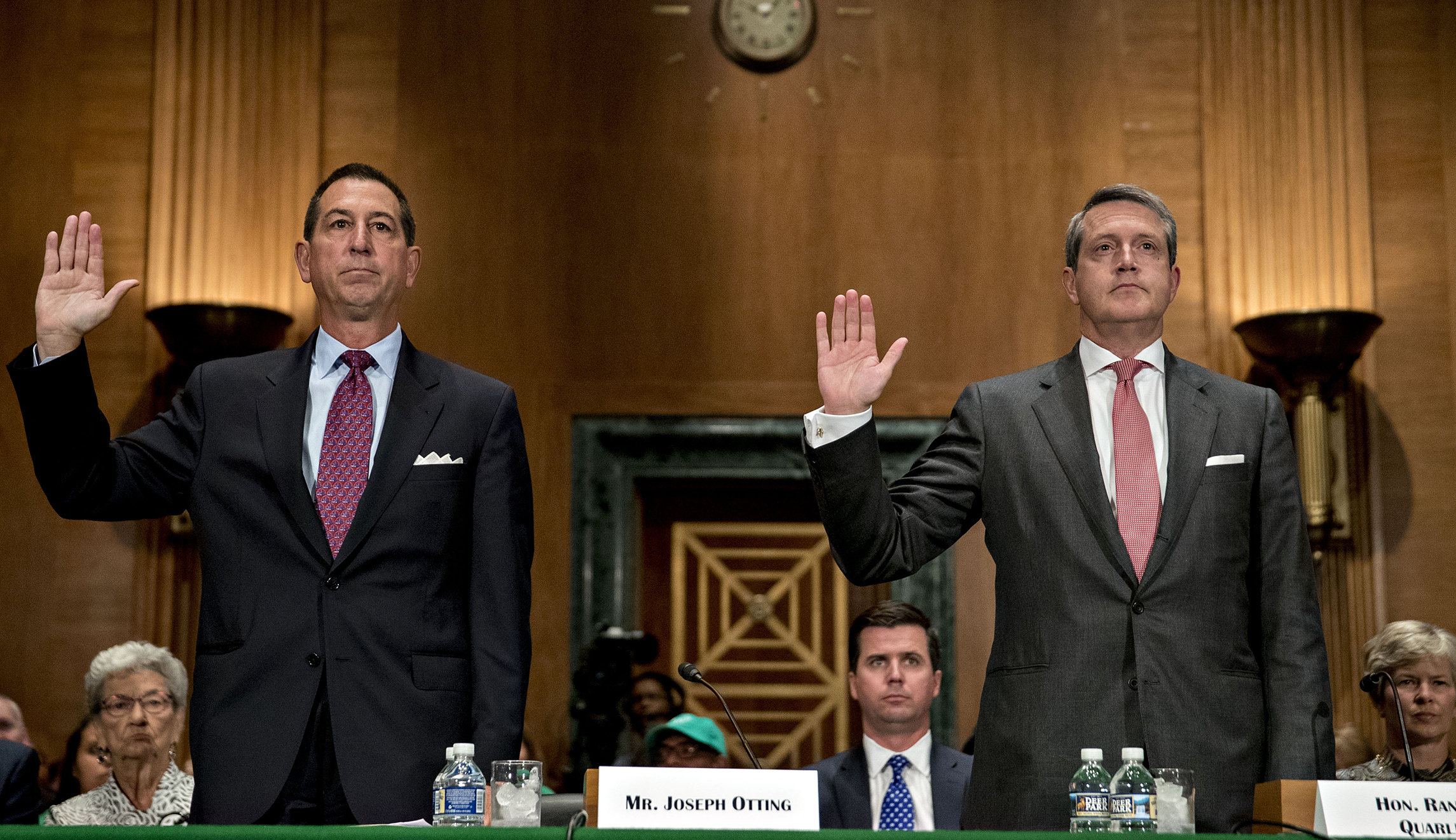 Two top Trump bank nominees advance in Senate
