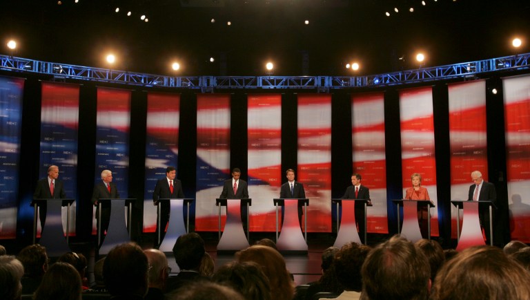 Democratic presidential hopefuls from left, Sen. Joseph Biden, D-Del., Sen. Christopher Dodd, D-Conn., New Mexico Gov. Bill Richardson, Sen. Barack Obama, D-Ill., former Sen. John Edwards, Rep. Dennis Kucinich, D-Ohio, Sen. Hillary Clinton, D-N.Y. and former Sen. Mike Gravel appear on stage for a debate at Dartmouth College Wednesday, Sept. 26, 2007. 