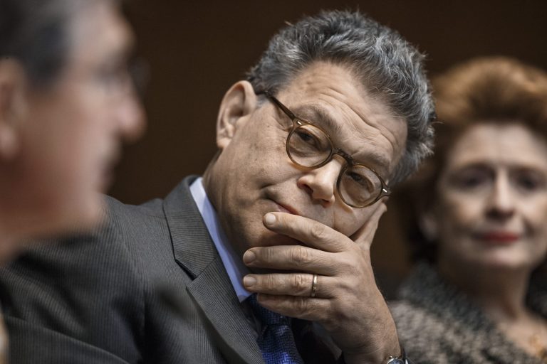 Sen. Al Franken, D-Minn., center, listens on Capitol Hill in Washington. Sen. Debbie Stabenow, D-Mich. is at right. (AP Photo/J. Scott Applewhite)