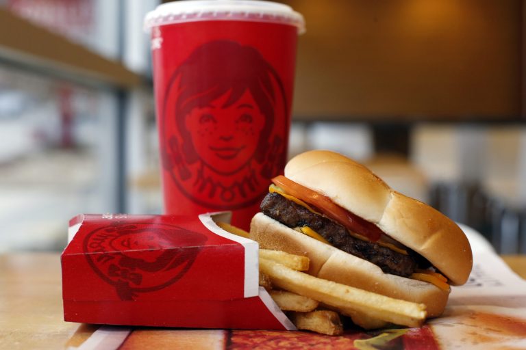This March 17, 2014 photo shows a Wendy's single hamburger with cheese combo meal at a Wendy's restaurant in Pittsburgh. Wendy's reports quarterly earnings on Thursday, May 8, 2014. (AP Photo/Gene J. Puskar)