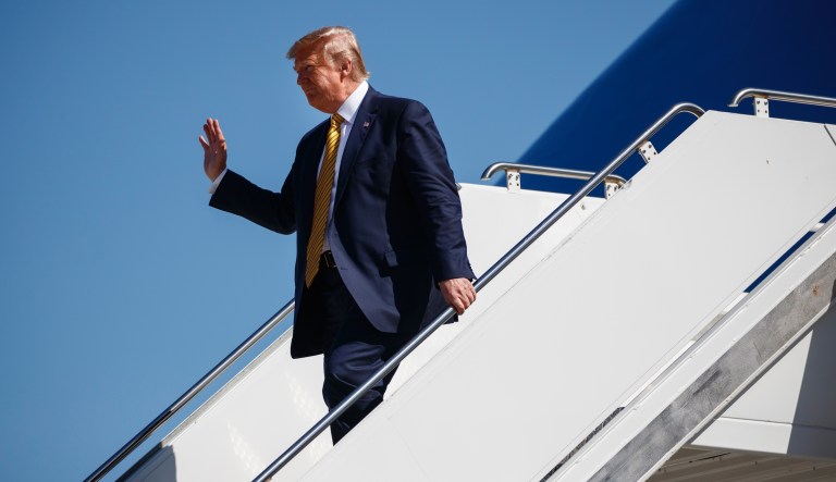 President Donald Trump waves as he arrives at Moffett Federal Airfield to attend a fundraiser, Tuesday, Sept. 17, 2019, in Mountain View, Calif.