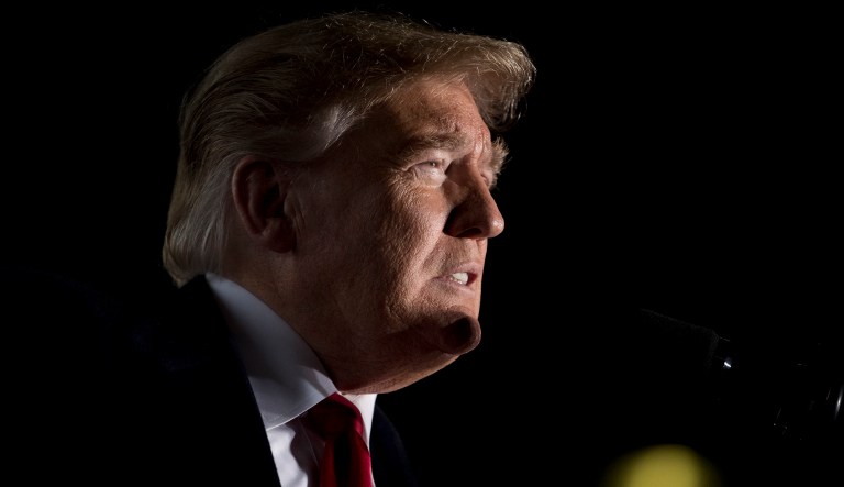 President Donald Trump pauses while speaking at a rally at Southern Illinois Airport in Murphysboro, Ill., Saturday, Oct. 27, 2018.