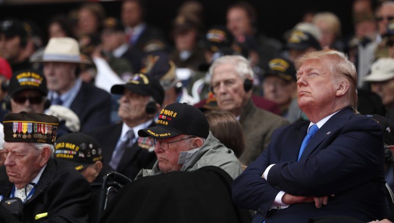 US President Donald Trump, right, attends a ceremony to mark the 75th anniversary of D-Day at the Normandy American Cemetery in Colleville-sur-Mer, Normandy, France, Thursday, June 6, 2019. World leaders are gathered Thursday in France to mark the 75th anniversary of the D-Day landings. 