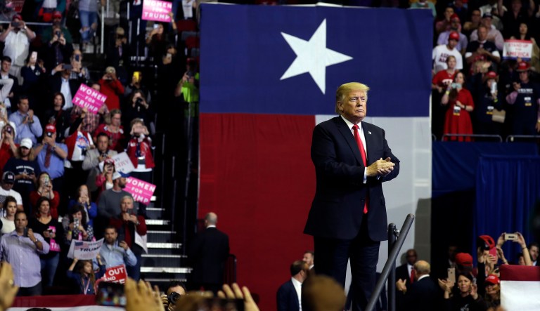 President Donald Trump applauds during a campaign rally for Sen. Ted Cruz, R-Texas, at Houston Toyota Center, Monday, Oct. 22, 2018, in Houston.