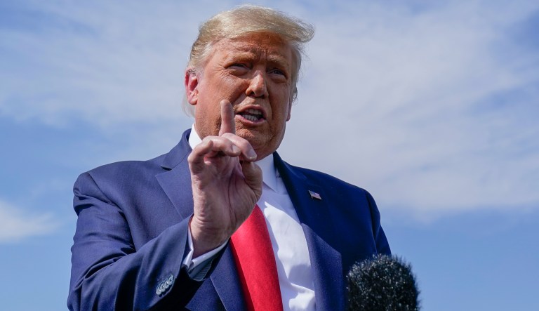 President Donald Trump talks to reporters at Phoenix Sky Harbor International Airport, Monday, Oct. 19, 2020, in Phoenix.