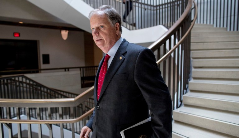 Sen. Doug Jones, D-Ala., arrives for a closed door meeting for Senators on election security on Capitol Hill in Washington, Wednesday, July 10, 2019.