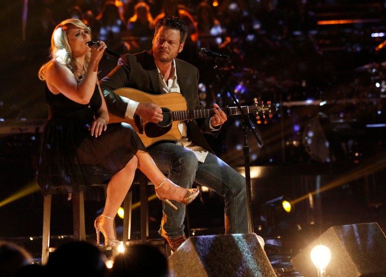 This May 21, 2013 photo released by NBC shows married singers Miranda Lambert, left, and Blake Shelton performing an acoustic version of the hit 