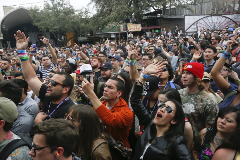 The crowd cheers during South by Southwest, the annualÂ music, technology and movie festival. This year, the eventÂ cancelled two panelsÂ after receiving threats of violence.Â (File Photo by Jack Plunkett/Invision/AP)