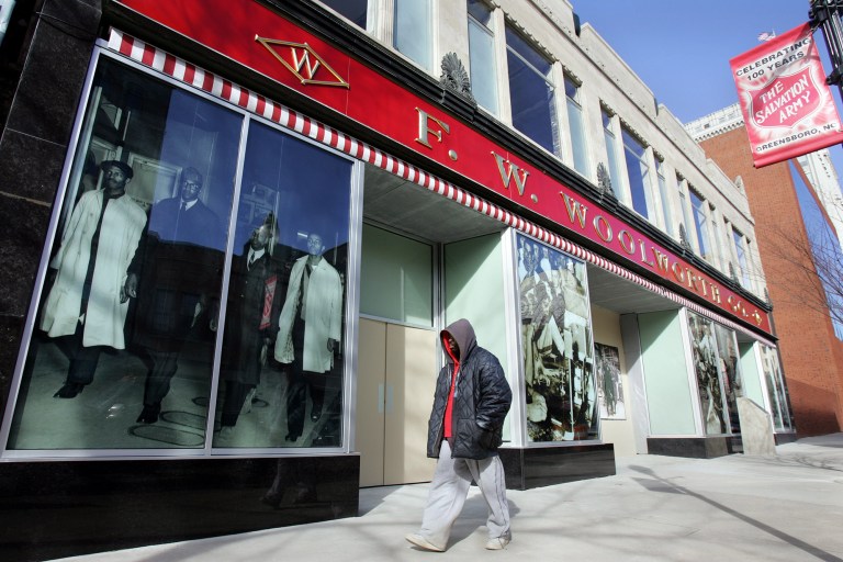   FILE - In this Feb. 2, 2005, file photo, a pedestrian makes his way past The International Civil Rights Center & Museum in Greensboro, N.C. The center is located in the F.W. Woolworth building, birthplace of the Civil Rights movement where four freshmen from historically black North Carolina A&T State University sat at the store's whites-only lunch counter and requested service. (AP Photo/Gerry Broome, File)  