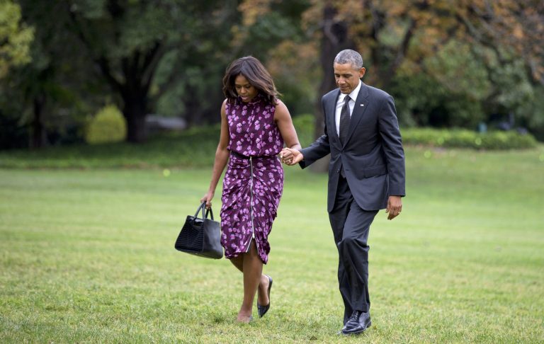 President Barack Obama and first lady Michelle Obama walk on the South Lawn of the White House in Washington, Thursday, Sept. 25, 2014, as they return to the White House from a trip to New York and the United Nations. (AP Photo/Manuel Balce Ceneta)