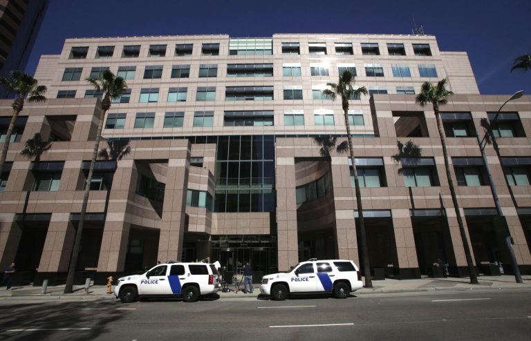 Homeland Security police cars are shown parked outside the Long Beach, Calif., Federal Courthouse. (AP Photo/Nick Ut)