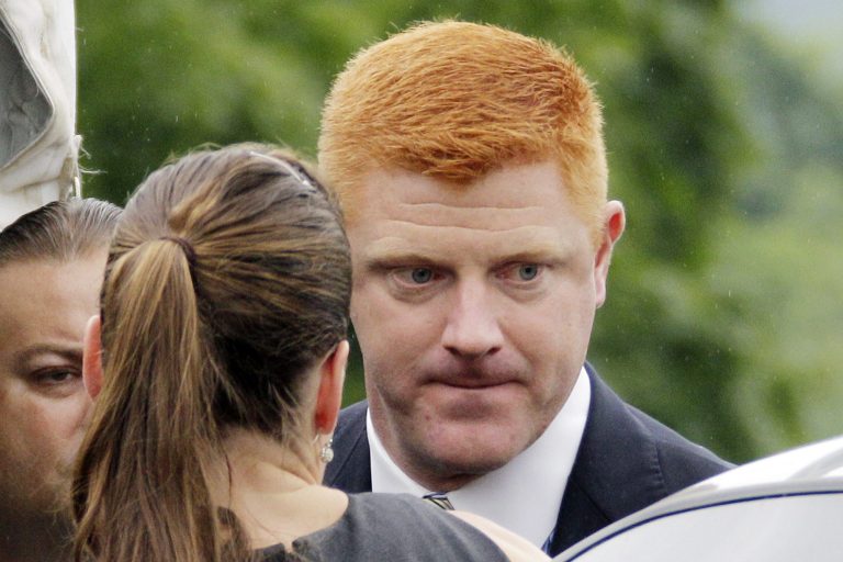   Penn State University assistant football coach Mike McQueary arrives at the Centre County Courthouse to testify in the child sexual abuse trial of former Penn State University assistant football coach Jerry Sandusky in Bellefonte, Pa., Tuesday, June 12, 2012. Sandusky is charged with 52 counts of child sexual abuse involving 10 boys over a period of 15 years. (AP Photo/Gene J. Puskar)  
