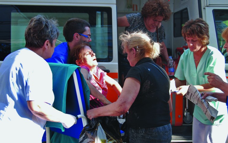 An unidentified injured Israeli tourist is carried in front of Borgas hospital after an explosion at Burgas airport, outside the Black Sea city of Burgas, Bulgaria, some 400 kilometers (250 miles) east of the capital, Sofia, Wednesday, July 18, 2012. A bus carrying young Israeli tourists in a Bulgarian resort exploded Wednesday, killing three people and wounding at least 20, police said. Witnesses told Israeli media that the huge blast occurred soon after someone boarded the vehicle. (AP Photo/ Bulphoto Agency) BULGARIA OUT