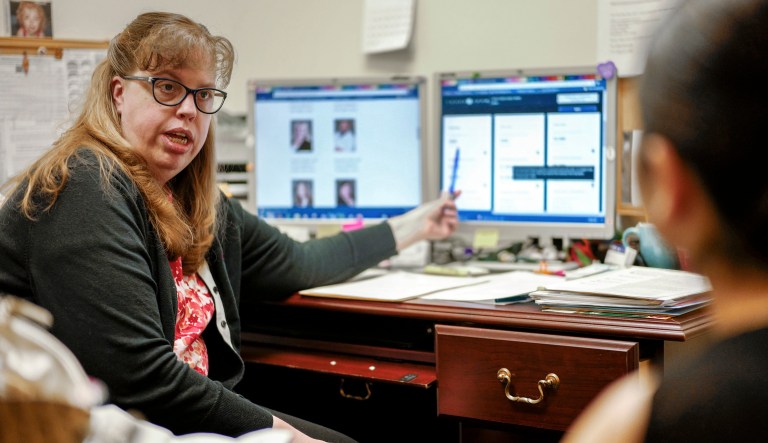In this Nov. 2, 2017 photo, Serena Reeves, health insurance marketplace navigator at the Community Action Partnership of Lancaster and Saunders County, left, helps Rifaah Hussein sign up for healthcare in Lincoln, Neb. So far, 8.8 million people signed up for Obamacare through healthcare.gov, which is used by residents in 39 states. (AP Photo/Nati Harnik)