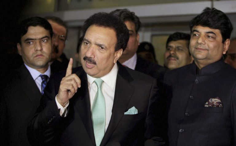   Pakistan's interior minister Rehman Mailk speaks to the media upon his arrival at the Indira Gandhi International (IGI) airport in New Delhi, India, Friday, Dec. 14, 2012. Malik arrived in India on Friday to introduce a new visa system that will make cross-border travel easier and said tensions between the nuclear-powered rivals have eased a great deal since the 2008 Mumbai terror attacks. (AP Photo) INDIA OUT  