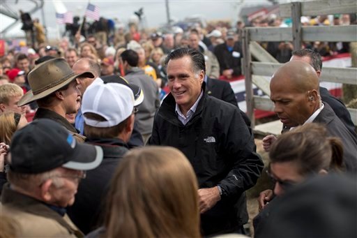 Republican presidential candidate, former Massachusetts Gov. Mitt Romney shakes hands with supporters during a campaign rally, Tuesday, Oct. 9, 2012, in Van Meter, Iowa.  (AP Photo/ Evan Vucci)