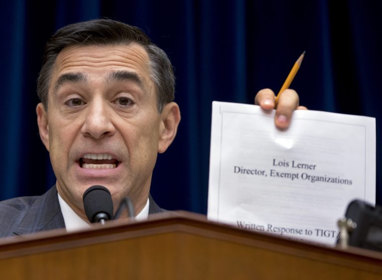 House Oversight Committee Chairman Rep. Darrell Issa, R-Calif., holds up a document as he speaks to IRS official Lois Lerner on Capitol Hill in Washington, Wednesday, May 22, 2013. (AP Photo/Carolyn Kaster, File)