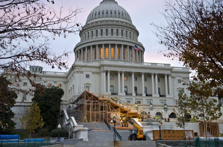   FILE - This Nov. 28, 2012 file photo shows construction contining on Capitol Hill in Washington, on the viewing stand for President Barack Obama's January's Inauguration Day ceremonies. Four years ago, Barack Obamaâs swearing-in drew a jubilant record crowd to the National Mall to witness history: the countryâs first black president taking the oath of office. This time, the capital is pre-occupied with a looming economic crisis, exit from war and reshuffling in Congress. It's almost as if Obama's swearing in on the Martin Luther King Jr. holiday is a been-there-done-that moment. (AP Photo/J. Scott Applewhite, File)  