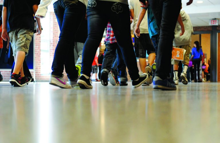 FILE - In this Sept. 11, 2012 file photo, students walk in the hallways as they enter the lunch line of the cafeteria at Draper Middle School in Rotterdam, N.Y. School for thousands of public school students is about to get quite a bit longer. Five states announced Monday, Dec. 3, 2012, they will add at least 300 hours of learning time to the calendar in some schools starting in 2013. (AP Photo/Hans Pennink, File)