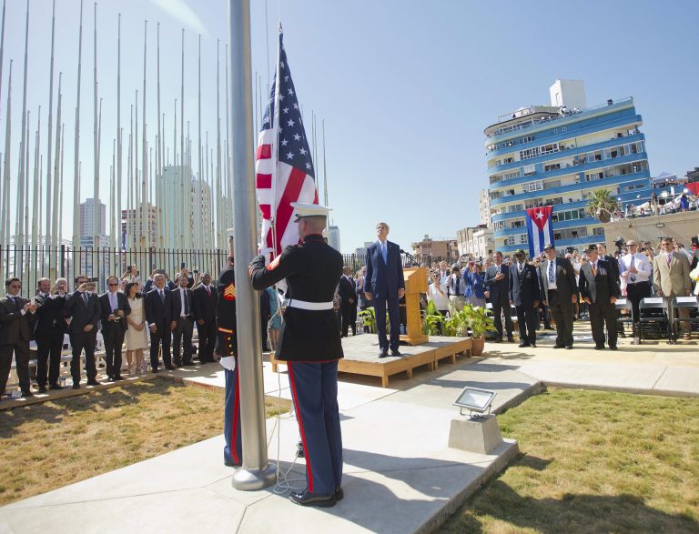 Secretary of State John Kerry, and other dignitaries watch as U.S. Marines raise the U.S. flag over the newly reopened embassy in Havana, Cuba. Friday. (AP Photo/Pablo Martinez Monsivais)
