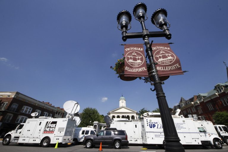   Television satellite trucks line South Allegheny Street in front of the Centre County Courthouse in Bellefonte, Pa., Sunday, June 10, 2012 in preparation for opening statements in the child sexual abuse trial of former Penn State Football assistant football coach Jerry Sandusky on Monday morning. (AP Photo/Gene J. Puskar)  