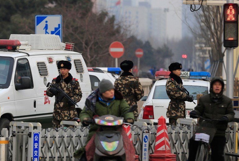 China on Sunday approved the country's first anti-terrorism law, amid concerns that its requirements that tech companies share information with the government could hurt business interests and further infringe upon human rights. (AP Photo/Andy Wong)