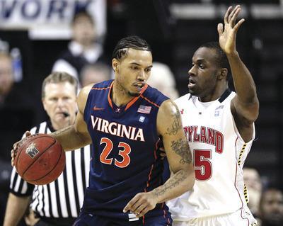 Patrick Semansky/AP
Virginia forward Mike Scott led the Cavaliers in scoring(18.1 points a game)and rebounding(8.4 a game)this season.