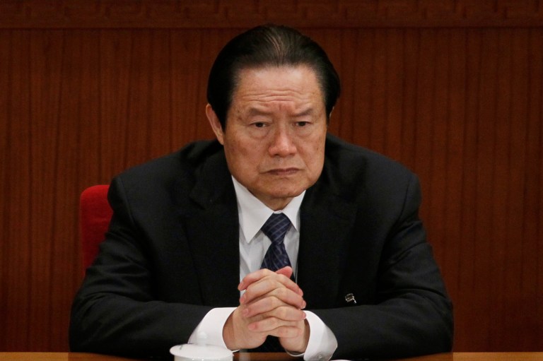 In this photo taken Friday, March 9, 2012, Zhou Yongkang, then Chinese Communist Party Politburo Standing Committee member in charge of security, attends a plenary session of the National People's Congress at the Great Hall of the People in Beijing, China. China's Communist Party says it has launched an investigation into the former domestic security chief who was once among the country's most feared leaders. The official Xinhua News Agency cited the party as saying Tuesday, July 29, 2014 it is investigating Zhou for serious violations of party discipline, but did not provide details. (AP Photo/Ng Han Guan)