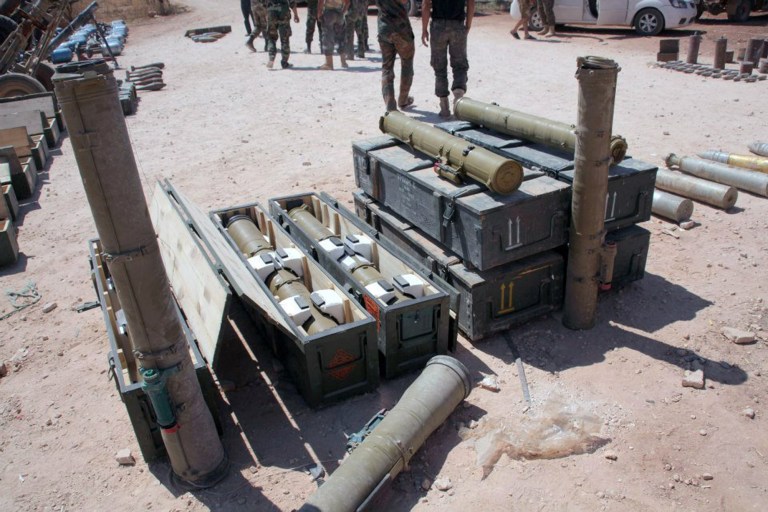 This Sunday July 6, 2014 photo released by the Syrian official news agency SANA, shows weapons that SANA says were captured by Syrian government forces in the Sheikh Najjar neighborhood of Aleppo, Syria. Syrian government forces last week seized the Sheikh Najjar neighborhood and a key industrial area, allowing them to choke off rebel-held parts of Aleppo. Syrian troops advanced inside and near northern Aleppo on Monday in what appears to be an attempt to lay siege to rebel-held parts of the country's largest city, activist said Monday. (AP Photo/SANA)