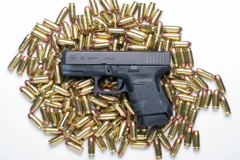 A Glock 30SF .45 Auto semi-automatic pistol with a standard ten-round magazine is seen with .45 Auto full metal jacket ball ammunition. (AP Photo/Cliff Owen)