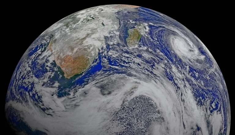 This image provided by NASA Data from six orbits of the Suomi-NPP spacecraft on April 9, 2015 have been assembled into this perspective composite of southern Africa and the surrounding oceans.  Tropical Cyclone Joalane is seen over the Indian Ocean. The image was created by the Ocean Biology Processing Group at NASA's Goddard Space Flight Center in Greenbelt, Maryland.