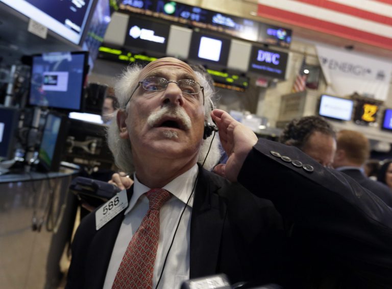 FILE - In this Friday, Jan. 17, 204, file photo, Trader Peter Tuchman works on the floor of the New York Stock Exchange. (AP Photo/Richard Drew)