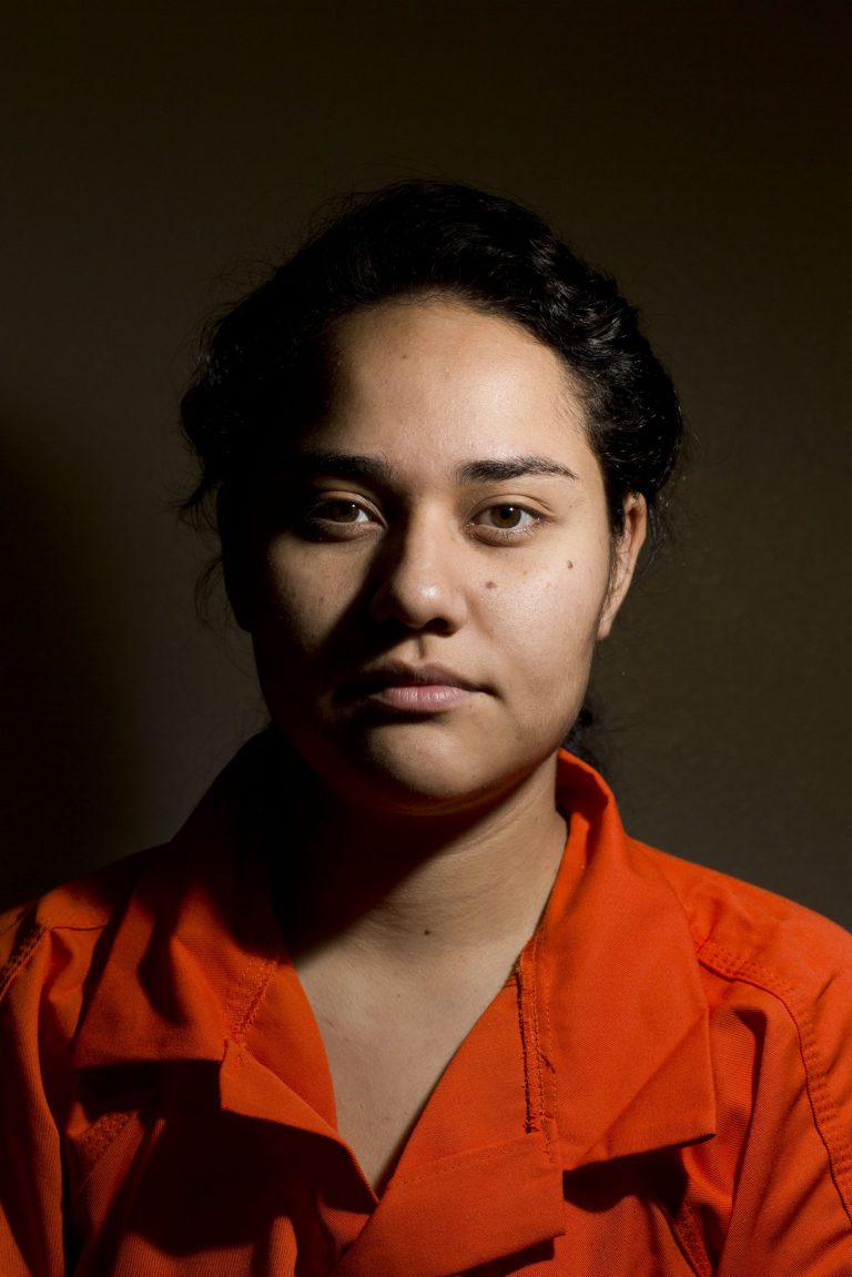   Maria Peniche, 22, poses for a portrait inside the Eloy Detention Center in Eloy, Arizona, Monday, Aug. 5, 2013. The Homeland Security Department took the highly unusual step of tentatively approved asylum requests for nine Mexican immigrants, including Peniche, who left the U.S. and attempted to re-enter as part of a protest against U.S. deportation policies. An immigration judge will have the final say whether they can remain permanently in the United States, but such a ruling could take years. (AP Photo/Nick Oza)  