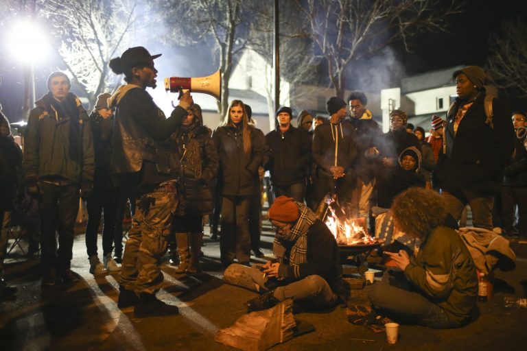 The shooting took place at about 10:45 p.m. Central time Monday night, as Black Lives Matter activists reportedly tried to move away from the men who had been taunting them. Then, the men opened fire into the encampment near the Minneapolis Police Department's 4th Precinct, hitting five people. (Jeff Wheeler/Star Tribune via AP)