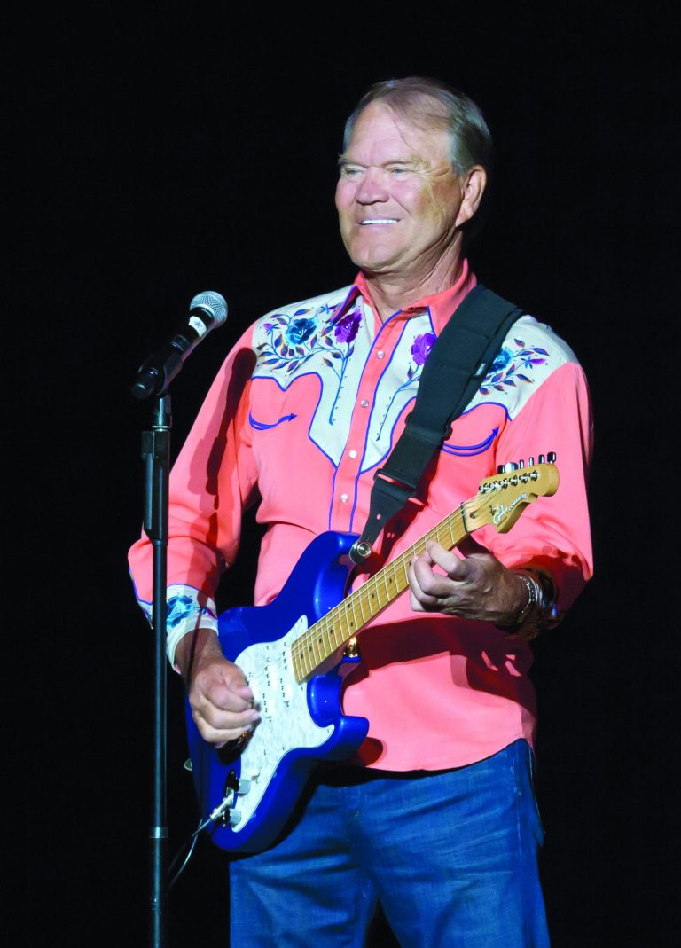 FILE - In this Sept. 6, 2012 file photo, singer Glen Campbell performs during his Goodbye Tour in Little Rock, Ark. Campbell finished off his Goodbye Tour on Friday night, Nov. 30, 2012, in Napa, Calif., but is considering scheduling more dates in 2013. The singer has Alzheimer's disease. (AP Photo/Danny Johnston, File)