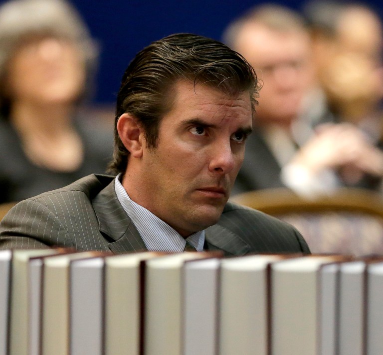 Democrat Chad Taylor listens to arguments before the Kansas Supreme Court in his petition to remove his name from the ballot after he withdrew from the U.S. Senate race Tuesday, in Topeka, Kan. Taylor's attempt to remove his name from the ballot has been disputed by Kansas Secretary of State Kris Kobach, a Republican, who backs incumbent Sen. Pat Roberts. Taylor's withdrawal from the race potentially improves the chances of independent candidate Greg Orman defeating Roberts. (AP Photo/Charlie Riedel)